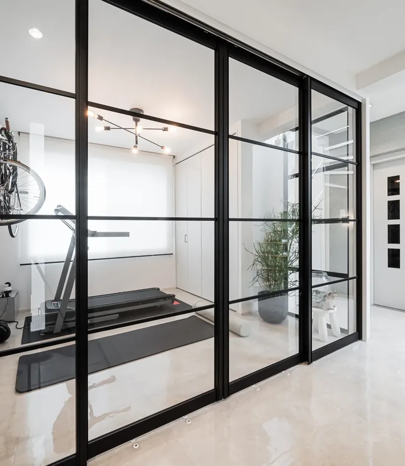 Floor-to-ceiling black aluminum glass walls