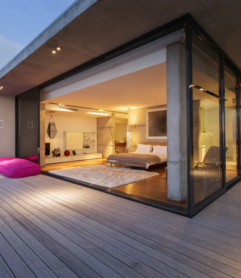 Oversized corner sliding doors opened to a deck